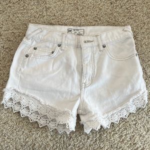 Gently worn, white free people shorts! High wasited with white lace trim.